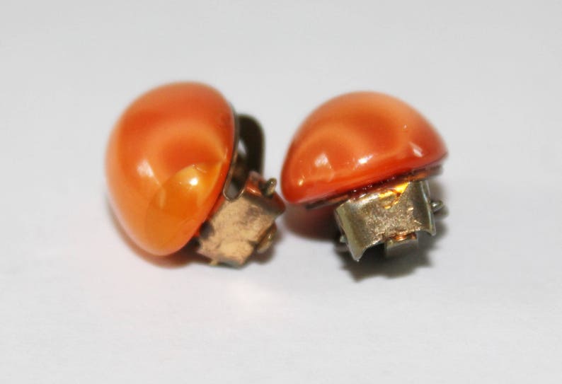 Vintage Orange Glass Earrings Clip Ons 1930s Glow Oval Cats Eye Pattern