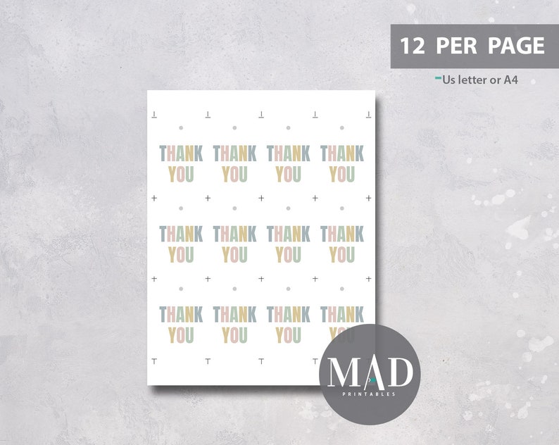 May include: A sheet of printable thank you cards with a repeating pattern. Each card features the words "THANK YOU" in pastel colours. The sheet is labelled "12 PER PAGE" and "Us letter or A4". A logo for "MAD PRINTABLES" is in the bottom right corner.