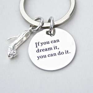 May include: Silver key ring with a silver high heel charm and a round silver tag with the text "If you can dream it, you can do it."