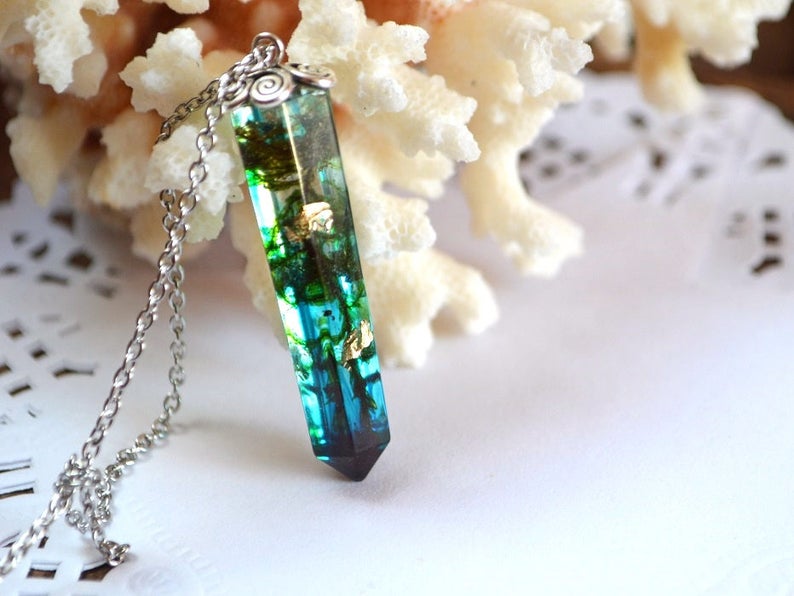 beautiful green resin crystal necklace of environmentally friendly epoxy, real forest  moss, gold flakes and special turquoise paint. on a chain. Resin Jewelry fascinatingly sparkles in the sun. This item will be an excellent gift for nature lovers.
