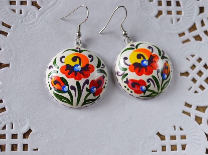 Handmade colorful earrings of wood, Multicolore flowers on a white background. with nickel free hooks, round 3 cm or 4 cm diameter. Hand painting jewelry women gift idea, folk art white, yellow, orange, green colors. Light weight and bright