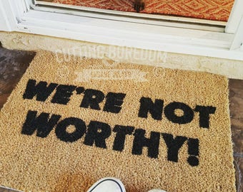 Funny doormat, we're not worthy!  The best place for a guest to wipe their feet!