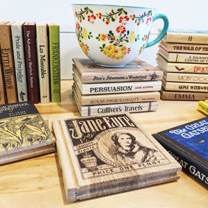 May include: A stack of vintage book-shaped coasters featuring classic literature titles like "Pride and Prejudice", "Great Expectations", "Moby Dick", and "Gone With the Wind". The coasters are made of wood and have a rustic, antique look.