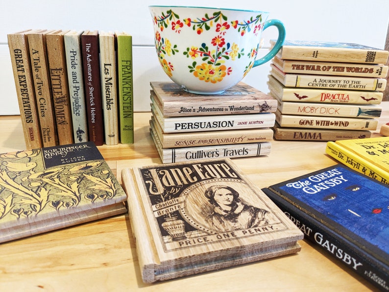 May include: A stack of vintage book-shaped coasters featuring classic literature titles like "Pride and Prejudice", "Great Expectations", "Moby Dick", and "Gone With the Wind". The coasters are made of wood and have a rustic, antique look.