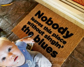 Funny doormat Nobody leaves this place without singin the blues,  entry rug,  movie quote,  adventures
