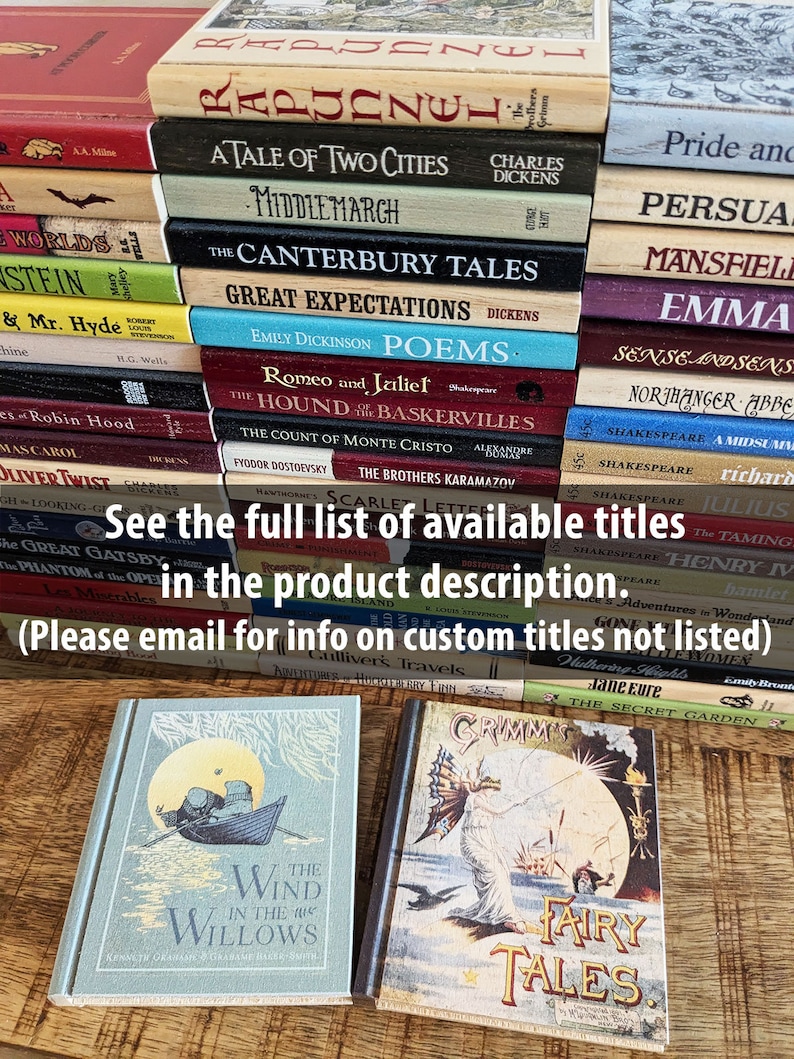 Wind in the Willows and Grimms fairy tales Wood book coasters sit in front of a stack of other titles. Over it, the text "see the full list of available title in the product description. please email for info on custom titles not listed".