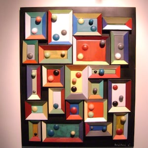 SOLD      a wood and paper wall sculpture titled &quot;gamestop&quot;