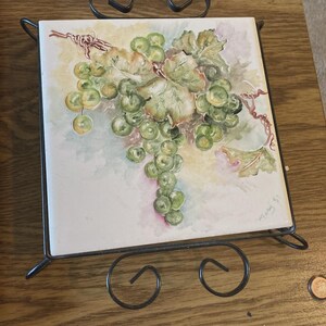 May include: A rustic wooden sign with the text "Welcome to our home" in white lettering. The sign features a distressed finish and a simple, inviting design, perfect for a front porch or entryway.