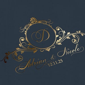 May include: Gold calligraphy on a dark blue background with a floral design and the text "Adrian & Nicole 12.11.25"