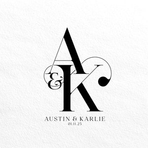 May include: Black and white monogram design featuring the letters "A" and "K" intertwined with an ampersand symbol. The letters are stylized and form a heart shape. The text "Austin & Karlie" and the date "01.11.25" are below the monogram.