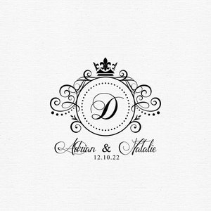May include: Black and white wedding monogram with a crown above the letter D. The text below reads "Adrian & Natalie 12.10.22".