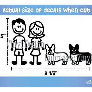 May include: Black and white stick figure family decal set with two children and two dogs. The decal set measures 5 inches tall and 8 1/3 inches wide.