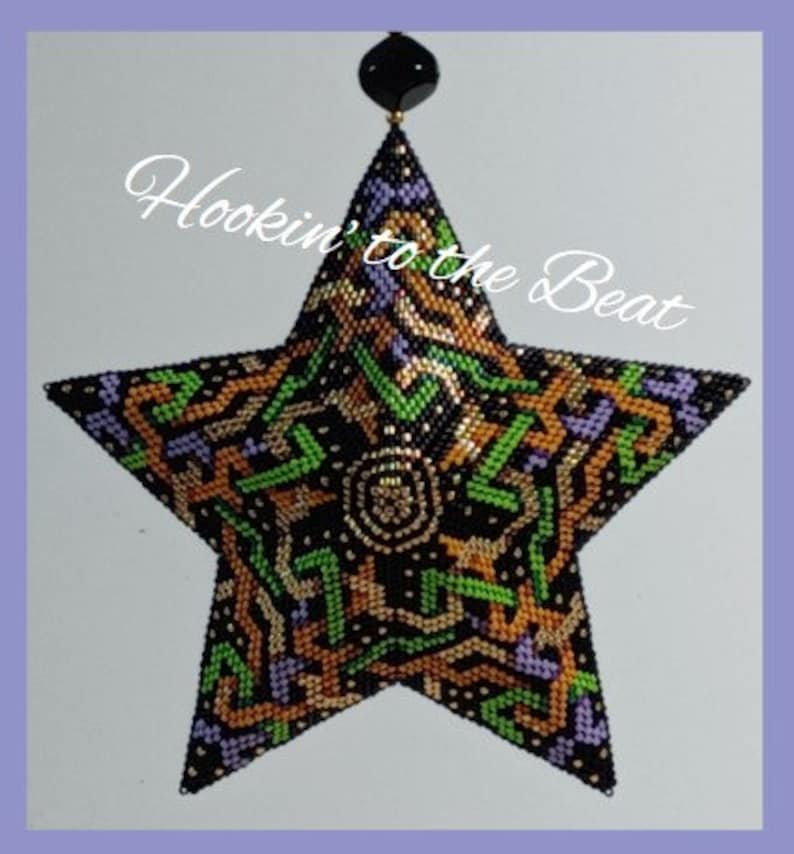 May include: A black, green, gold, and purple beaded star ornament with a geometric pattern. The ornament is hanging from a black bead. The text "Hookin' to the Beat" is written in white on a black background.