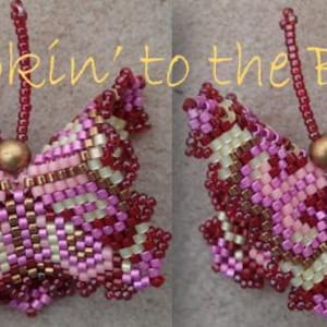 May include: Two beaded butterfly ornaments. The butterflies are made with small beads in shades of pink, red, and gold. The text "Hookin' to the Beat" is written in yellow cursive above the butterflies.