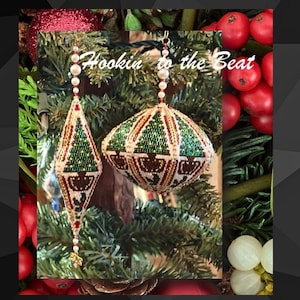 May include: Two beaded Christmas baubles with a green and gold tree design. The baubles are hanging from a Christmas tree and the text "Hookin' to the Beat" is visible in the background.