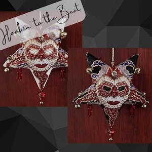 May include: A white, red, and gold beaded star ornament with a jester face and bells. The ornament is hanging from a string. The text "Hookin' to the Beat" is written in white on a black background.