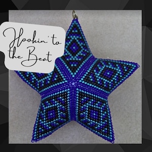 May include: A blue, black and teal star-shaped ornament with a geometric pattern. The ornament has a loop at the top for hanging. The text "Hookin' to the Beat" is written on a white background.