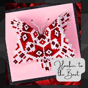 May include: A red and white beaded butterfly with a geometric pattern. The butterfly is displayed on a pink background with the text "Hookin' to the Beat".