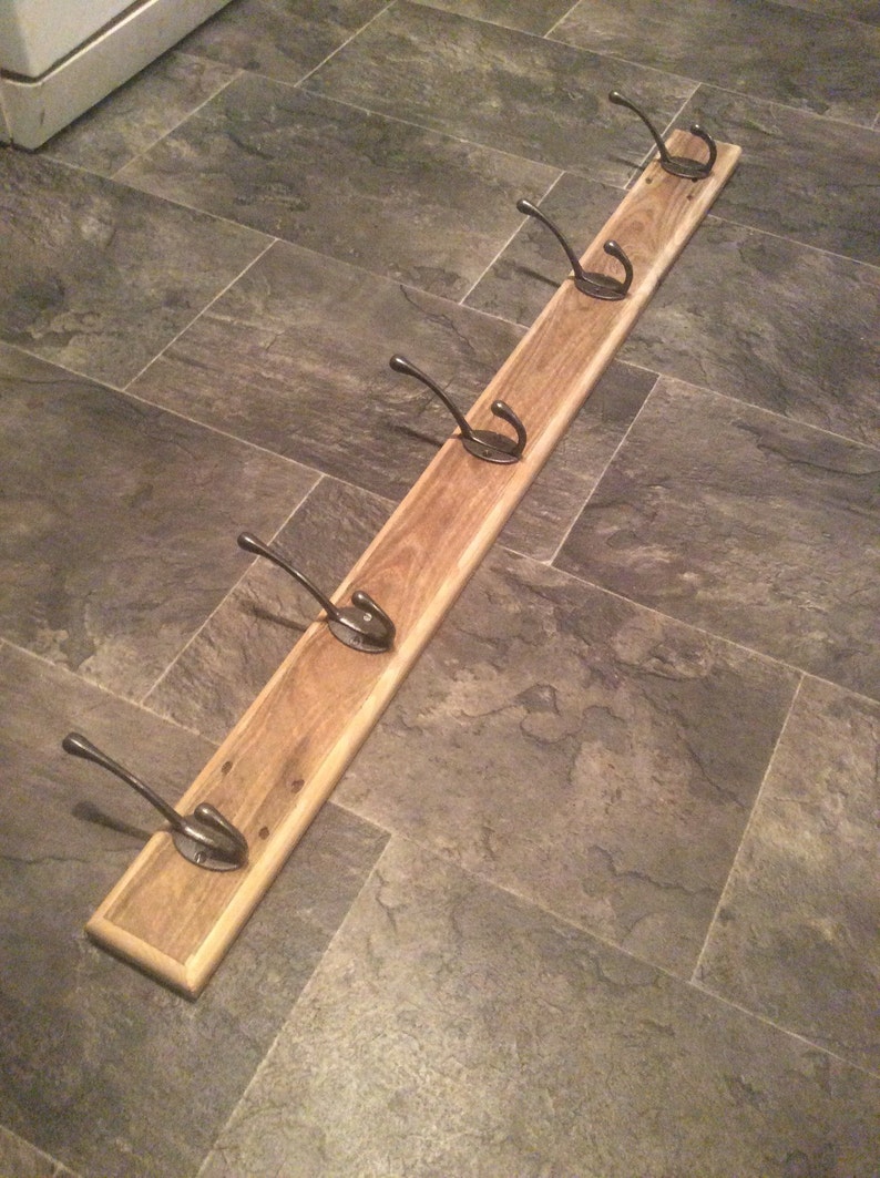 rustic coat rack made from reclaimed pallet wood with 5