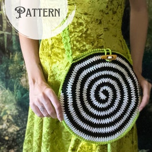 May include: A crochet pattern for a black and white spiral circle bag with a lime green strap. The bag is being held by a person wearing a lime green dress.