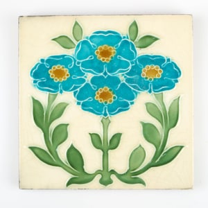 Antique 1900s Minton Art Nouveau four blue and amber flower pottery tile.