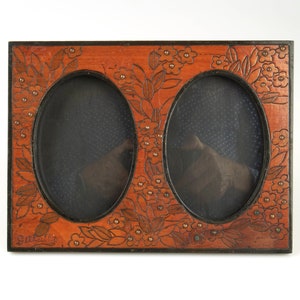 Antique French 1920-30s Art Deco carved and pen work wooden easel double photograph frame.