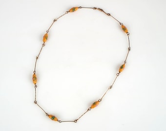 Antique 1920-30s yellow Wedding Cake glass bead and gilt metal necklace.