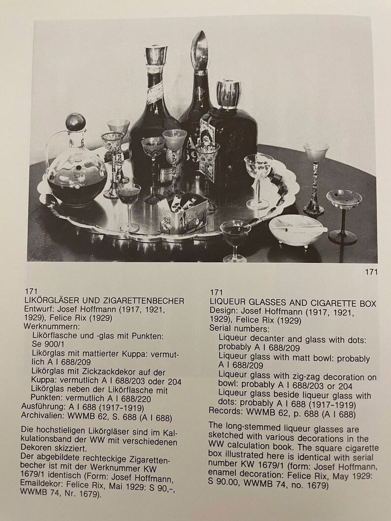 May include: A set of clear glass liquor glasses and a square cigarette box with a black and white design. The glasses have long stems and various decorations. The box is labeled with the text "KW 1679/1".