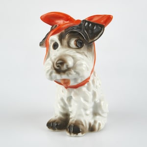 Joli chien japonais Art Déco en porcelaine noir et blanc vintage des années 30 avec noeud rouge.