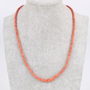 Antique Victorian coral bead necklace with plated gold barrel clasp.