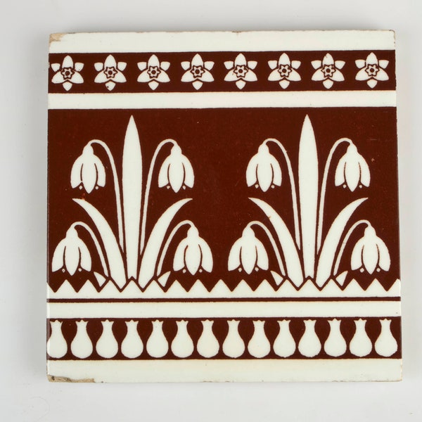 Antique 1880s Minton Snowdrop pottery tile designed by Christopher Dresser.