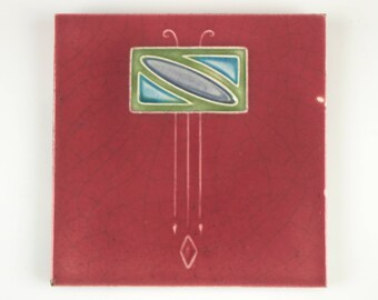Antique 1900s Malkin Tile Co. Art Nouveau stylised flower design pottery tile with pink background.