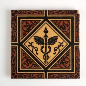 Antique 19th century Minton Caduceus pottery tile.