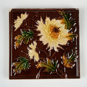 Antique 1880-1900 Victorian relief chrysanthemums pottery tile.