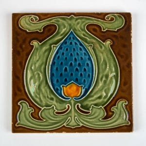 May include: A square ceramic tile featuring a central blue, textured, teardrop-shaped motif surrounded by light green, swirling, organic leaf-like patterns. The background is a deep brown, and a small, bright yellow bud sits at the base of the blue shape.