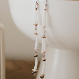 Boucles d'oreilles en perles violettes fabriquées par Dentalium