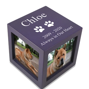 May include: Purple wooden pet memorial box with two paw prints and the text "Chloe 2009-2020 Always in Our Heart". The box has two photo slots with pictures of a brown dog.