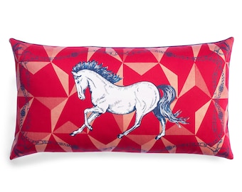 May include: Red rectangular pillow with a white horse running across a geometric pattern. The pillow has a blue border with a chain link design.