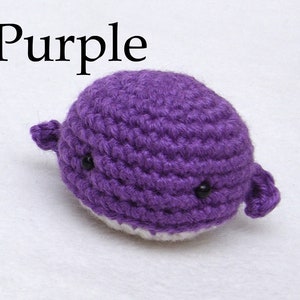 May include: Purple crocheted whale plushie with black eyes.