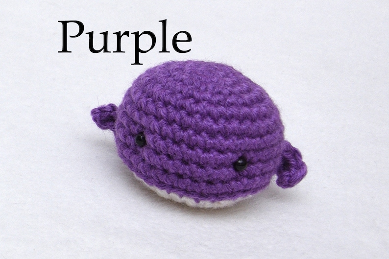 May include: Purple crocheted whale plushie with black eyes.