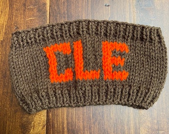 Cleveland Browns “CLE” hand knitted headband in brown and orange.