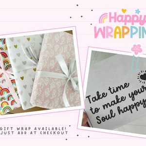 May include: Three gift boxes wrapped in colorful paper with ribbons. The boxes are on a pink and white striped background. The text "Happy Wrapping" is in the upper right corner of the image. The text "Take time to make your Soul happy" is on a gray box in the lower right corner of the image.