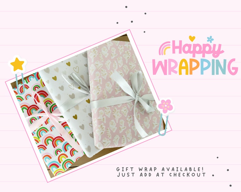 May include: Three wrapped gifts with decorative paper and ribbons. The wrapping paper features patterns of rainbows, hearts, and floral designs. The image includes the text "Happy WRAPPING" in colorful letters.