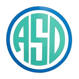 May include: A teal blue monogram with the letters "ASD" in a circle with a white outline and a blue border.