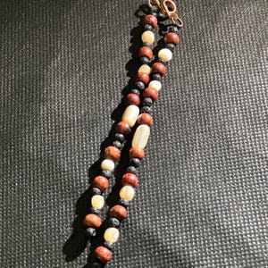 Narra and shell with lava stones