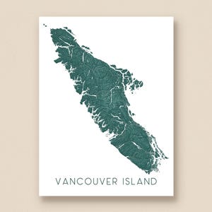 May include: A teal-colored topographical map of Vancouver Island, printed on white paper. The map shows the island's terrain with detailed shading and the text "VANCOUVER ISLAND" at the bottom.