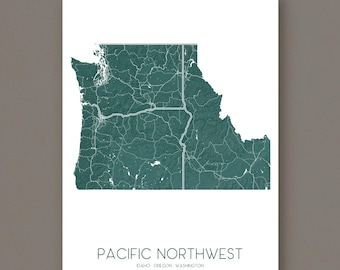 May include: A teal and white print of the Pacific Northwest region, including Idaho, Oregon, and Washington. The map shows the states' outlines and road networks. The words "PACIFIC NORTHWEST" are printed at the bottom.