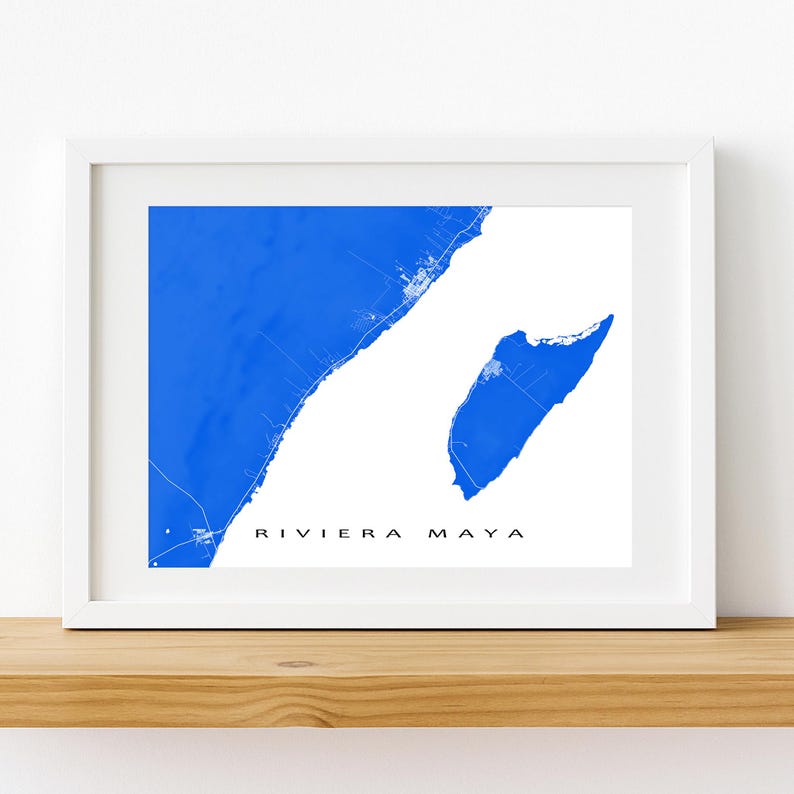May include: A framed print featuring a blue map of the Riviera Maya region against a white background. The map is detailed with coastlines and small town outlines. The words "RIVIERA MAYA" are printed in black at the bottom.