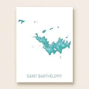 May include: A white print featuring a teal map of Saint Barthélemy. The map is detailed with textured shading, and the island's name is printed in teal below the map. The print is on a white background.