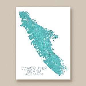 May include: A teal and white print of Vancouver Island, British Columbia. The map is a topographical representation of the island, with the text "Vancouver Island" and "British Columbia" below the map.